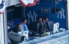Kay (far left) with Paul O'Neill, Ken Singleton, and Ryan Ruocco providing play-by-play commentary for the Yankees on YES Michael Kay, Paul O'Neill, Ken Singleton in broadcast booth.jpg