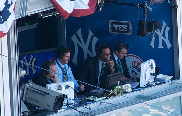 Kay (far left) with Paul O'Neill, Ken Singleton, and Ryan Ruocco providing play-by-play commentary for the Yankees on YES