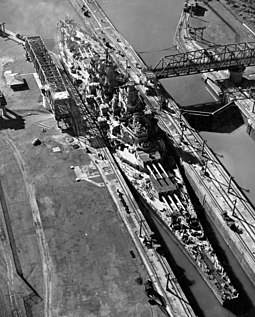 The USS Missouri, an Iowa-class battleship, passes through the canal in 1945. The 108' 2" (32.96 m) beams of the Iowas and preceding South Dakota class were the largest ever to transit the Canal. Missouri panama canal.jpg