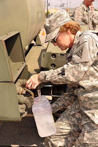 General Ashenhurst Pouring Water Jugs to Support Water Emergency in Holland, Ohio Ohio National Guard activated to support water emergency in Lucas, Wood and Fulton Counties 140803-Z-ZJ624-089.jpg