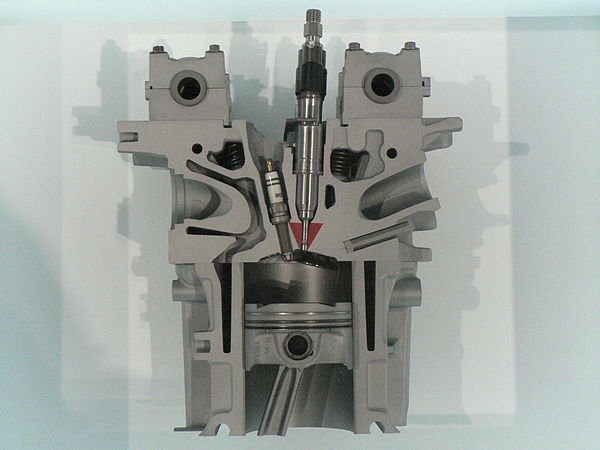 A cutaway model of a petrol direct-injected engine