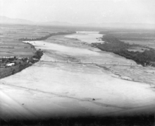 Aerial photograph of Burdekin Bridge construction site showing piers with Railway Bridge in foreground c 1952 Queensland State Archives 3685 Aerial photograph of Burdekin Bridge construction site showing piers with Railway Bridge in foreground c 1952.png