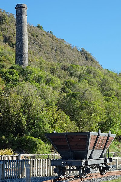 File:Restored Q class railway coal wagon in front of Tyneside mine chimney at Brunner Mine.jpg