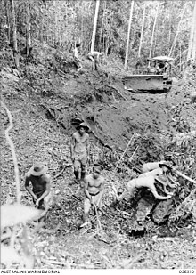 The 2/14th Field Company improves the road from Ilolo Road building beyond Moresby.jpg