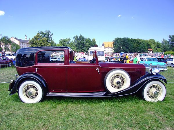 Example of the Sedanca de Ville style body from 1934 with a covered passenger compartment and open chauffeur cabin