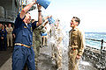 SS Ronald Reagan (CVN 76) Buckets of Water spilled over sailors after promotion to Capt. and Lt. Cmdr. - 080901-N-4995K-045.jpg