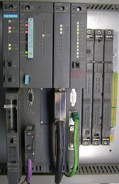 Siemens Simatic S7-400 system in a rack, left-to-right: power supply unit (PSU), CPU, interface module (IM) and communication processor (CP).