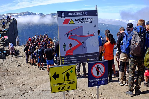 Signs warning tourists about the risk associated with going out to Trolltunga