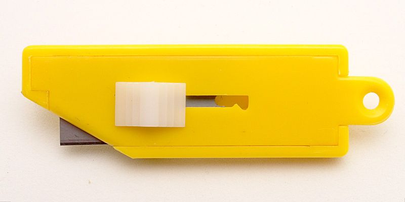 File:Simple yellow plastic box cutter blade extended.jpg