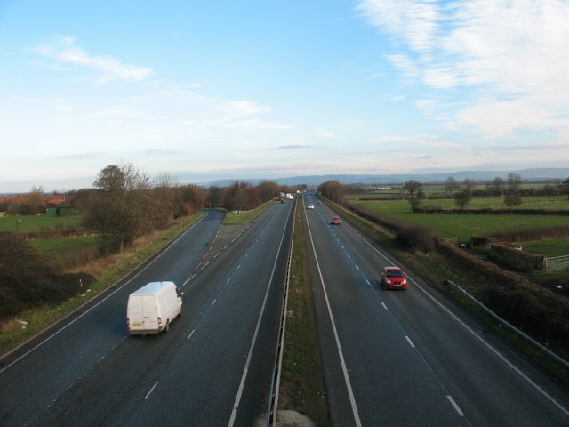 Left turn for Topcliffe, with the North York Moors seen in the distance