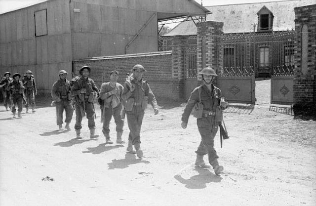 Men of the 7th Battalion, Argyll and Sutherland Highlanders, marching in Millebosc, France, 8 June 1940.