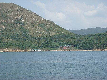 Distant view of the Tin Hau Temple in Fat Tong Mun, Joss House Bay. The hill on the left is Tin Ha Shan. Tin Hau Temple, Joss House Bay1.JPG