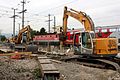 * Nomination Two excavators dig out old concrete parts in the station Neunkirchen (Austria). In the background a double-decker train of ÖBB with ÖBB 1144 passes through the station. --Steindy 00:40, 30 December 2014 (UTC) * Promotion Good quality. --Hubertl 01:41, 31 December 2014 (UTC)