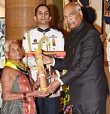 Tulsi Gowda an India environmentalist receiving Padma Shri award from President Ram Nath Kovind