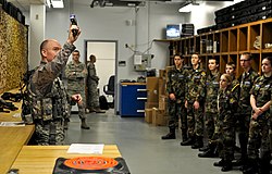 U.S. Air Force Master Sgt. Blake A. Pumphrey, head of mobility and resources at the 182nd Security Forces Squadron, demonstrates a Taser X26 spark test for Civil Air Patrol cadets at the 182nd Airlift Wing in Peoria, Ill. U.S. Air Force Master Sgt. Blake A. Pumphrey demonstrates a Taser X26 for Illinois Wing Civil Air Patrol cadets.jpg