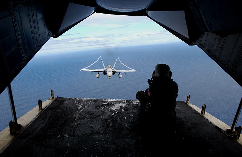 File:US Navy 031025-N-9411J-010 Photographer's Mate 3rd Class Beth Thompson, from San Francisco, Calif., photographs an F-A-18 Hornet.jpg