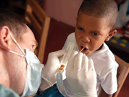 Tập tin:US Navy 090526-F-1333S-023 A service member embarked aboard the Military Sealift Command hospital ship USNS Comfort (T-AH 20) gives a Fluoride treatment to a patient during a Continuing Promise 2009 medical civil service projec.jpg