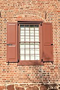 South wall Flemish bond brickwork, brownstone foundation, and iron beam anchors