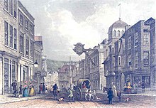 Winchester's High Street in 1853; the number of High Streets, the primary street for retail in Britain in towns and cities rapidly grew in the 18th century. Winchester High Street Mudie 1853.jpg