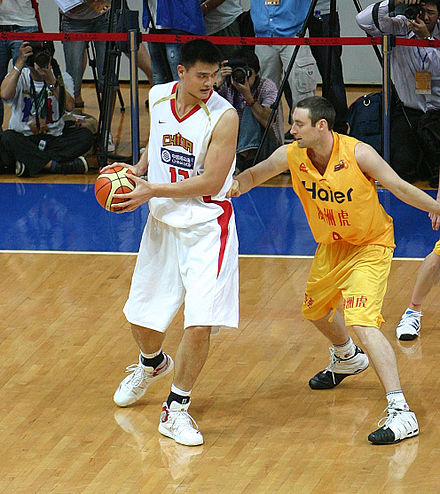 International players like Chinese Yao Ming (in white) have increased interest abroad and opened opportunities in China.