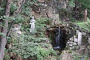 A statue and waterfall in the complex (2022)