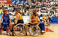 Action during a women's wheelchair basketball game between Australia and the United States AUS-USA women's basketball game, 1992 Paralympics.jpg