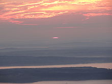The first rays of sun in the United States as seen from Cadillac Mountain