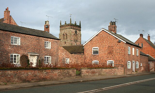 The centre of Acton village, with St Mary's church tower in the background