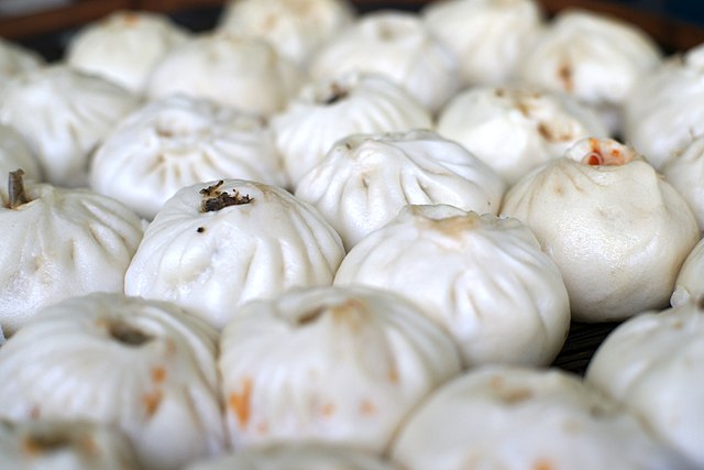 Meat-filled baozi for sale in a market