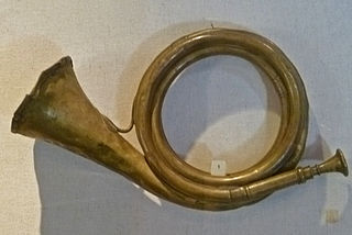 The post horn is a valveless cylindrical brass instrument with a cupped mouthpiece. The instrument was used to signal the arrival or departure of a post rider or mail coach. It was used especially by postilions of the 18th and 19th centuries.
