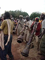 Berta people playing trumpets