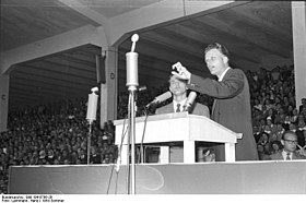 One of the prominent evangelical revivalists, Billy Graham preaching in Duisburg, Germany, in 1954. Bundesarchiv Bild 194-0798-29, Dusseldorf, Veranstaltung mit Billy Graham.jpg
