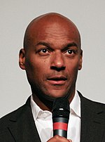 Colin Salmon portrays George Knight. Colin Salmon 2008-10a (cropped).jpg