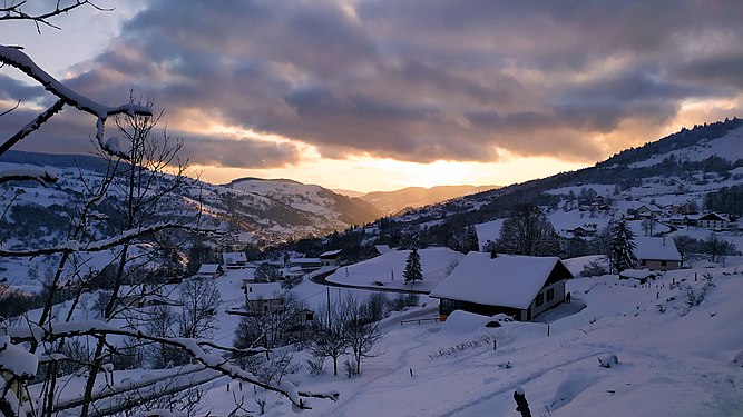 Sunset over the snowy Chajoux valley, in the Vosges (France).