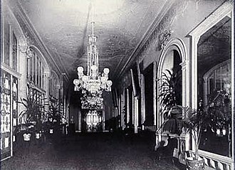 The Cross Hall c. 1898, showing James Hoban's original Ionic columns and Louis Comfort Tiffany's glass screen separating the Cross Hall and Entrance Hall CrossHallMcKinley.jpg