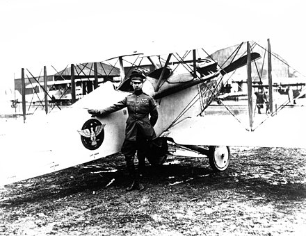 Mitchell posing with his Vought VE-7 Bluebird aircraft at the Bolling Field Air Tournament in Washington, D.C., held on May 14–16, 1920[16]