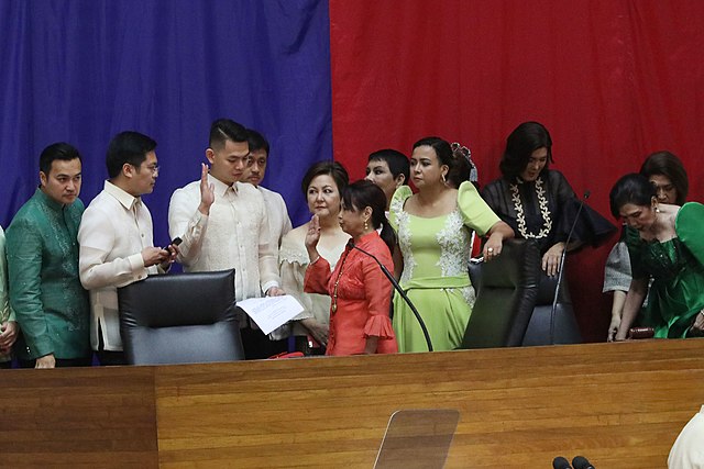 Gloria Macapagal Arroyo takes oath as Speaker of the House of Representatives.