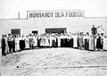 Group of workers standing outside a processing building, Normandy Sea Food Co, San Diego, California, ca 1918 (INDOCC 85).jpg