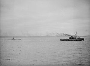 HMS Stubborn being towed by a tug off Greenock, after being damaged by depth charges HMS Stubborn - towed.jpg