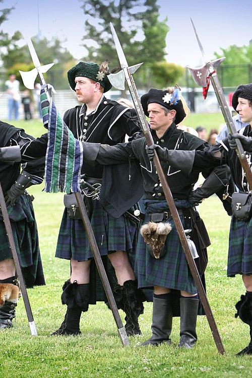 Reenactors wielding Halberds. The Halberd was a common weapon during the Renaissance and medieval times, which were also the age of knights.