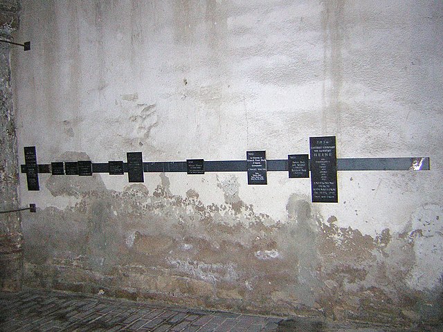 Photo of Sponsorships lining the St. Burchardi church, Halberstadt by Wikipedia user "Wikipedia-ce", 2005, https://commons.wikimedia.org/wiki/File:HalberstadtBurchardiChurchMemorialPlaques.jpg