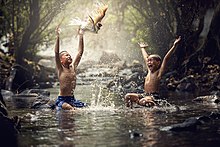 Happy children splashing water.jpg