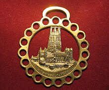 A modern souvenir horse brass featuring Gloucester Cathedral Horsebrass.jpg