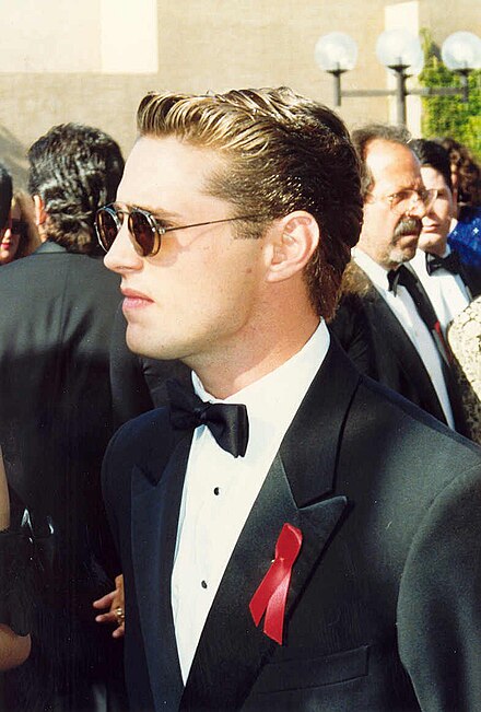 Actor Jason Priestley wearing a red awareness ribbon at the 1992 Emmy Awards