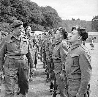 Lieutenant Colonel Charles Vaughan inspecting French troops Lieutenant Colonel Charles Vaughan, Commandant Commando Depot, inspecting French troops during a parade to mark Bastille Day at Achnacarry in Scotland, 17 July 1943. H31439.jpg