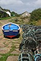 A boat and lobster pots at Penberth Cove