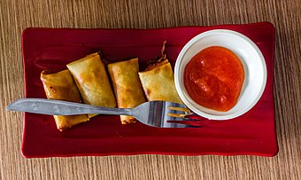 Smaller size deep fried lumpia served with sambal hot sauce, sold as a snack in Purwokerto Train Station, Central Java