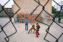 "Three boys and 'A Train' graffiti in Brooklyn's Lynch Park in New York City"