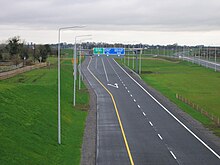 A junction on the M4 motorway in Ireland, with an unbroken yellow line (that peels away and follows the sliproad) demarcating the hard shoulder. M4 Heading west at J11 (start of the N6 near Kinnegad.jpg