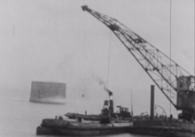 Tally Toor during breakwater construction, 1942 Martlello tower.png